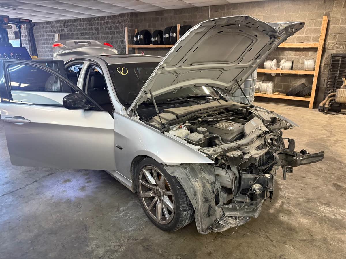 Silver BMW being dismantled